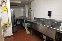1st Floor Kitchen Dishwashing Area (view of dishwasher area looking toward NW corner to back side of pass-through window)
