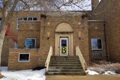 Building Exterior (west side of Board Room with entrance door "B" and Library sign from earlier years)(far / wide view)