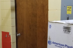 Looking west in gym storage across from phy ed office