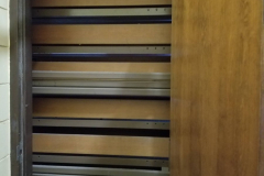 1st Floor Gymnasium  (view behind door in gym storage room to left of main gym entrance doors)