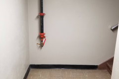 Sub-level Storage Room (looking east from storage room toward steps leading to first floor)