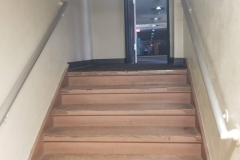 Sub-level Storage Room (looking north from stair landing to steps leading to 1st floor hallway)