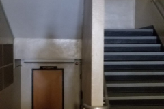 Looking south at central stairway on 1st floor