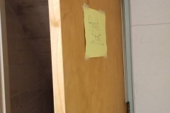 Under steps storage on south end of building - looking south