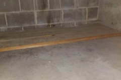 Under steps storage on south end of building - looking east