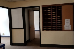 213 (looking south toward pass-through to 212 and mail slots to right)