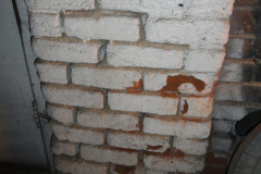 Older painted red brick on the south wall