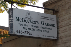 McGovern's Garage sign mounted on east side of building