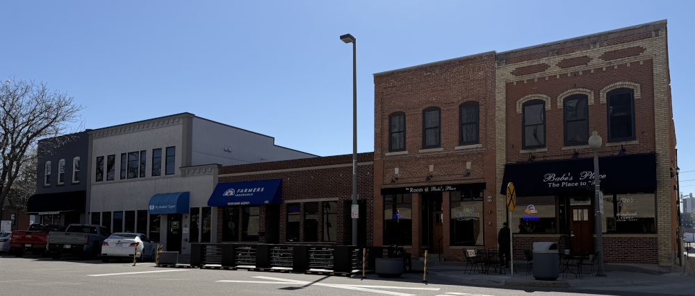 Looking west on Holmes Street between the alley and Second Ave (April 2025)